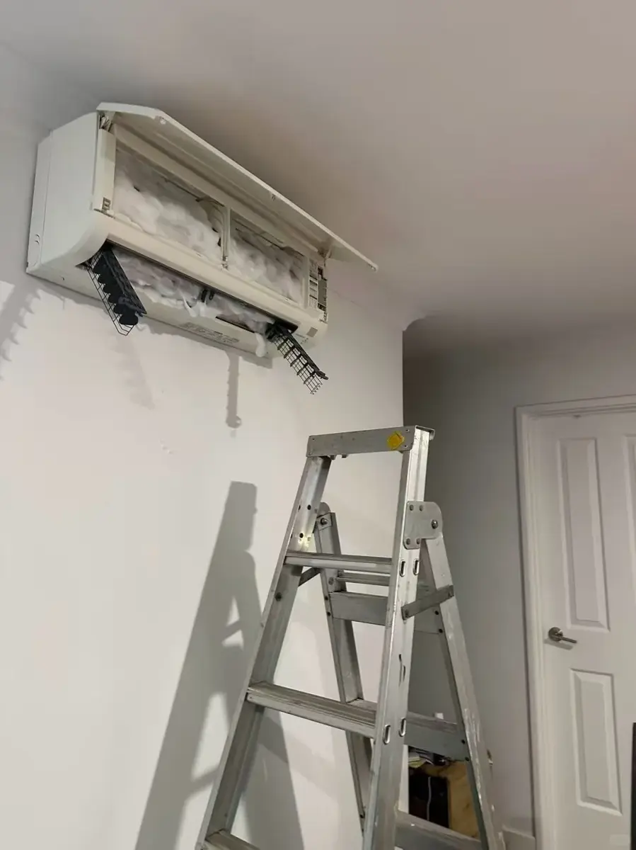 Ice across an opened indoor wall air conditioner