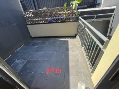 Balcony with a dark tiled surface finish