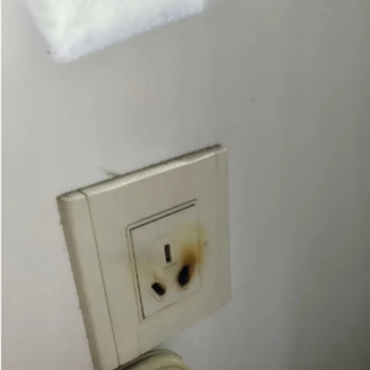 Heat-damaged power point before electrical work